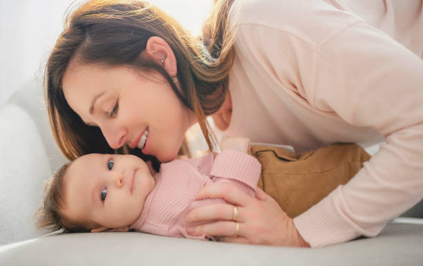 istock Mother with her baby son on sofa 1408227224