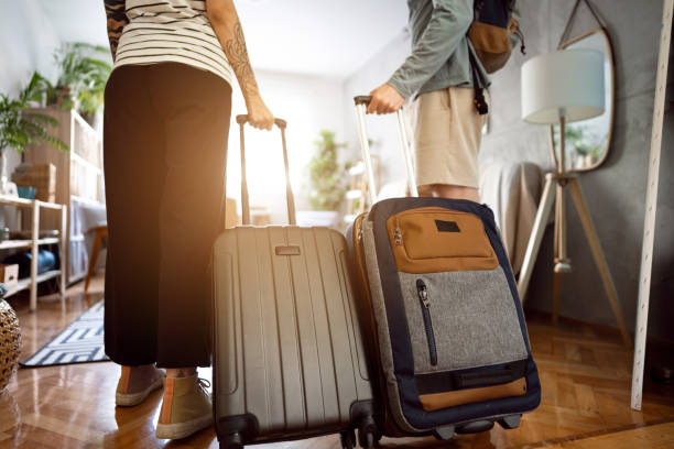 istock Unrecognizable couple arriving at the accommodation with their suitcases 1408230691