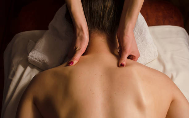 istock Young woman relaxes on thai massage, close up 1408231511