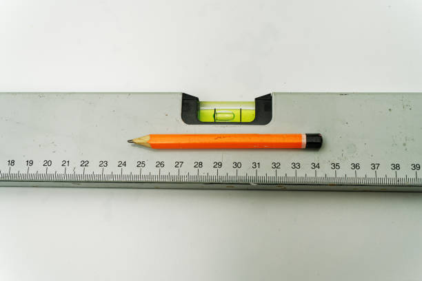 istock spirit level with orange pencil 1408232639