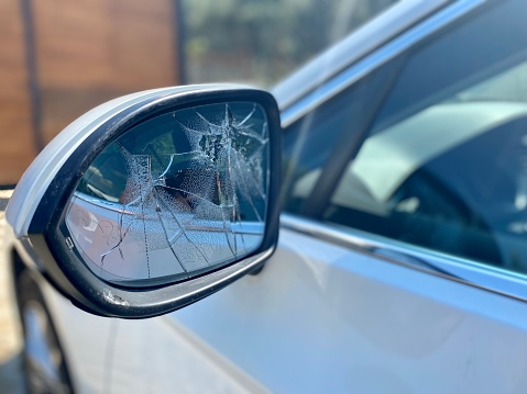 Broken car mirror with accident