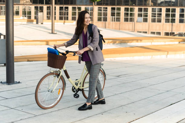 istock Japanese woman with a bicycle going to work 1408235456