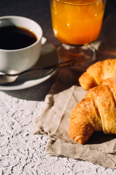 istock delicious breakfast, coffee and croissants on the table 1408235580