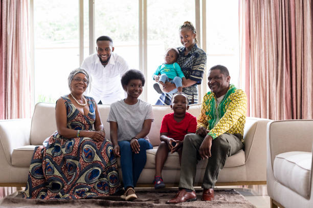 istock Multi generation family on couch posing for a portrait 1408236063