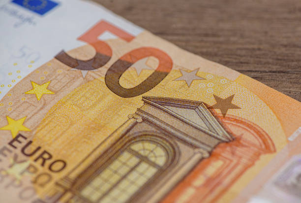 50 euro ( banknote ) standing on the wooden table