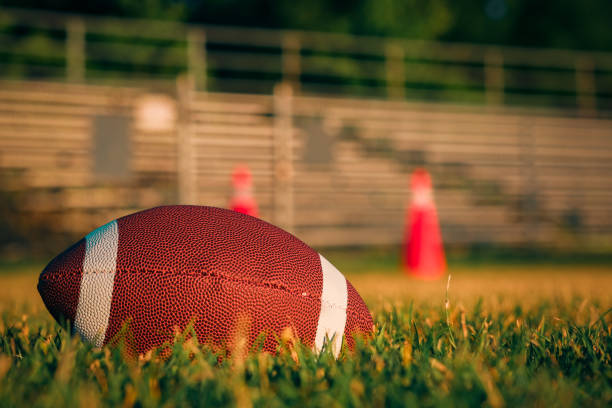 istock Football and Helmet 1408237422
