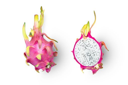 Dragon fruit (pitaya, pitahaya) half slice isolated on white background, top view, flat lay.