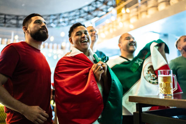 istock Mexican fans watching a soccer game at a bar 1408239413
