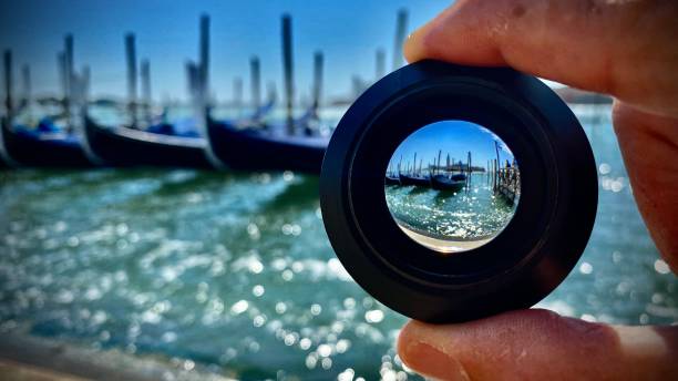istock through the lens - gondolas moored in the harbor at st. mark's square - venice, italy. 1408239877