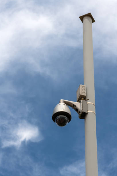 istock Street surveillance camera on a white metal pole 1408240032