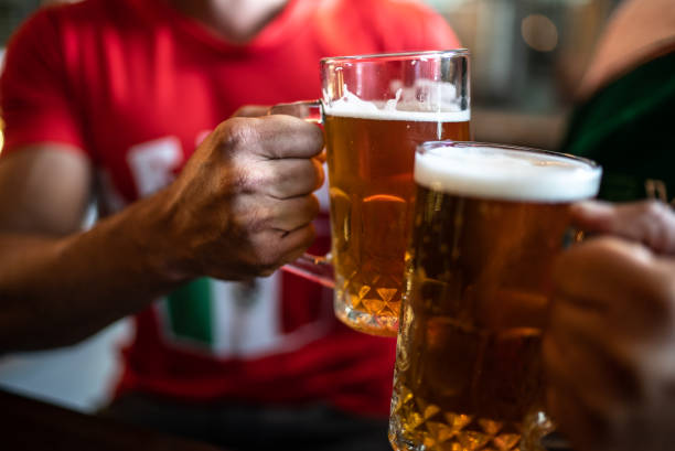 istock Friends toasting a beer at a bar 1408241323