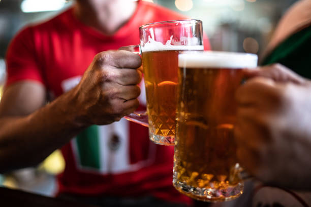 istock Friends toasting a beer at a bar 1408241324