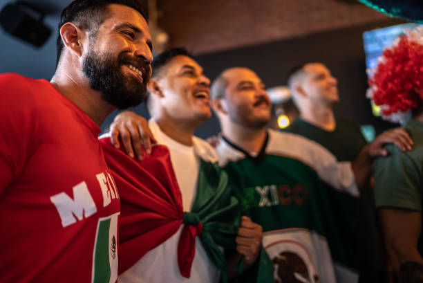 istock Mexican fans watching a soccer game at bar 1408241330