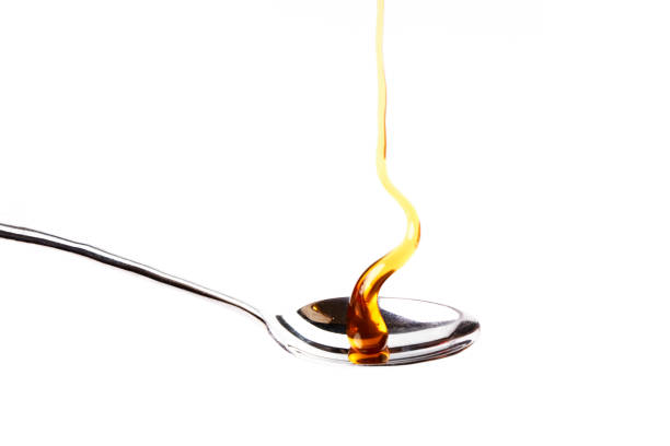 istock Delicious honey dripping on a teaspoon. Healthy food 1408242503