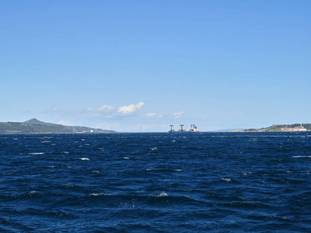 istock Cargo ship crossing the strait , 1915 Canakkale Bridge in background 1408242540
