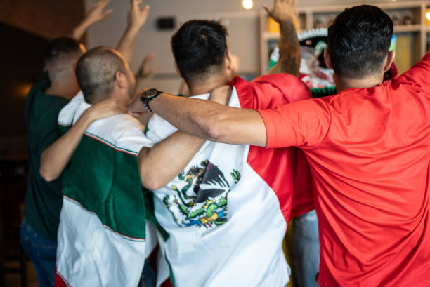 istock Mexican fans celebrating a goal in soccer game at bar 1408242578