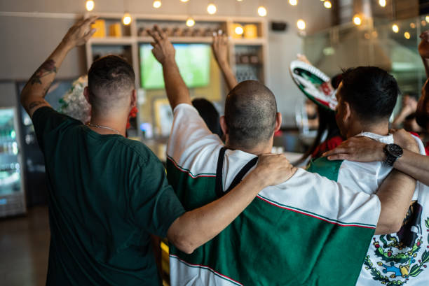 istock Mexican fans celebrating a goal in soccer game at bar 1408242590