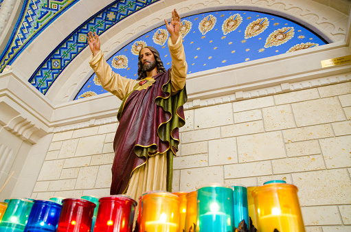 Statue of Jesus with his hand raised in Ste-Anne-de-Beaupre Basilica