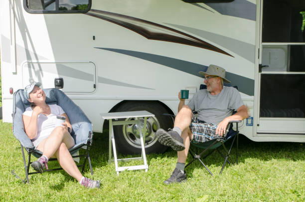istock Mature couple discussing besides their motorhome 1408243911