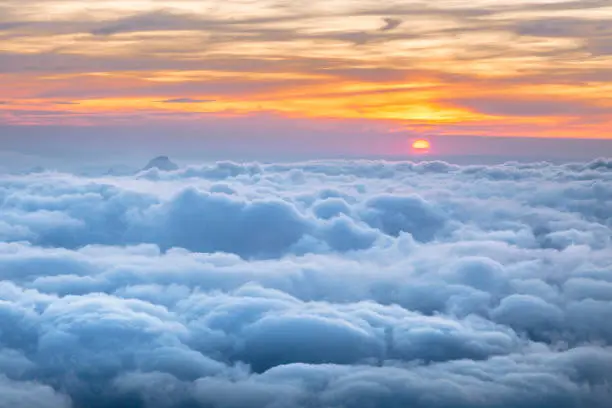 Beautiful clouds view from The Cosmiques Hut, Aiguille du Midi in the evening light, Chamonix-Mont-Blanc, France