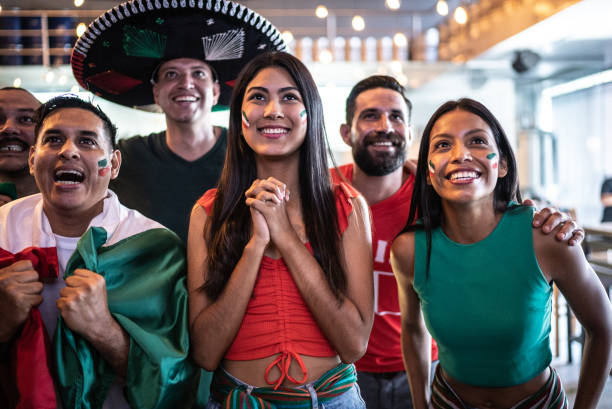 istock Mexican fans watching soccer game at bar 1408244418