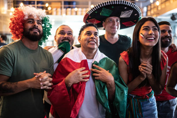 istock Mexican fans watching soccer game at bar 1408244430