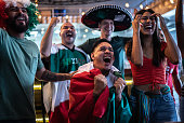 istock Mexican fans celebrating a goal in soccer game at bar 1408244446