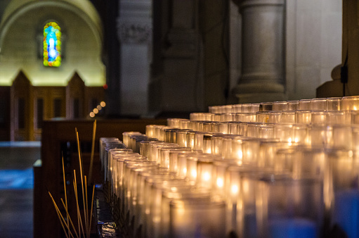 Rows of lit religious candles at the Ste-Anne-de-Beaupré Basilica near Quebec city.