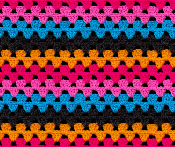 istock Seamless knitted texture. The pattern is crocheted from bright contrasting colors of acrylic yarn. 1408247402