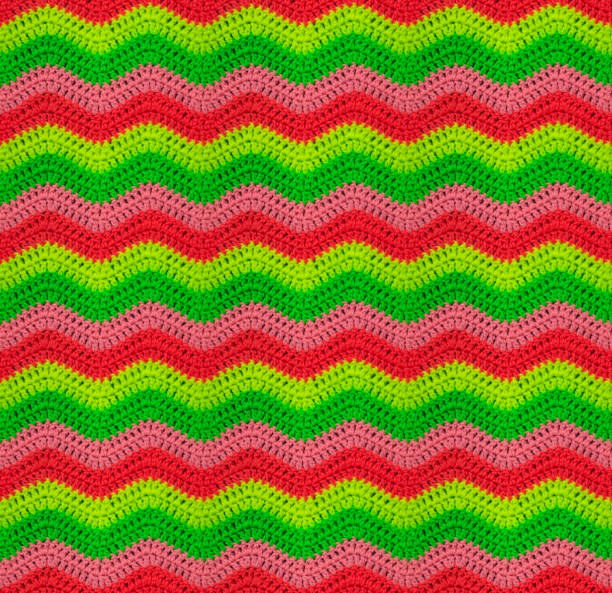 istock Seamless crochet zigzag pattern is crocheted in bright neon threads.  Acrylic baby yarn. 1408247422