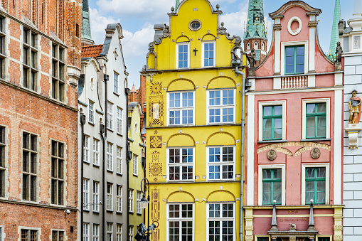 Old buildings facades in old town of Gdansk (Srodmiescie historic district). Blue sky is on the background.