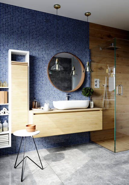 istock Interior of a modern bathroom with blue tiled walls, large mirror and a shower. 3d rendering 1408249225