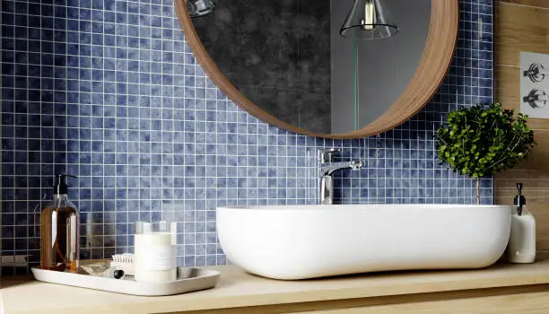 3d rendering. Interior of a modern bathroom with blue tiled walls, large mirror and a white washbasin. Scandinavian style.