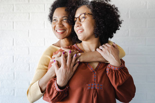 istock Gay couple hugging and looking away 1408249361