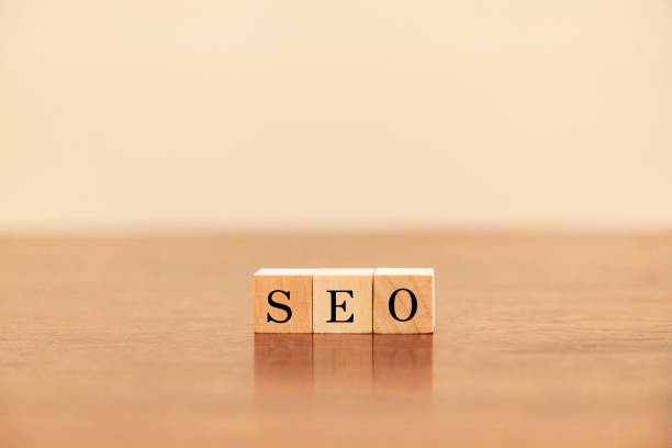 istock SEO. Search Engine Optimization. Search engine optimization. SEO letters drawn on a wooden block. 1408250674