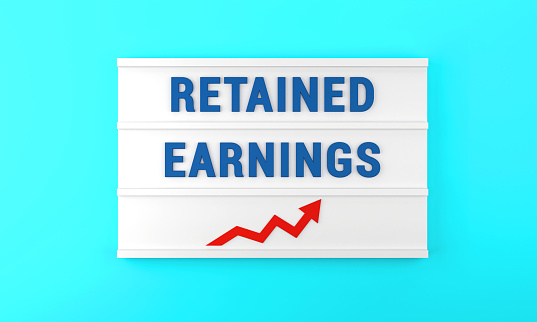 Success arrow and Retained Earnings text on the lightbox, on the blue background. Finance and Economy concept.