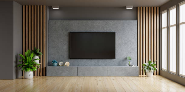 istock Concrete wall mounted tv in modern living room. 1408255002