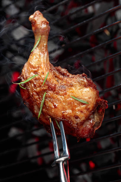istock Chicken with rosemary on a grill. 1408257069