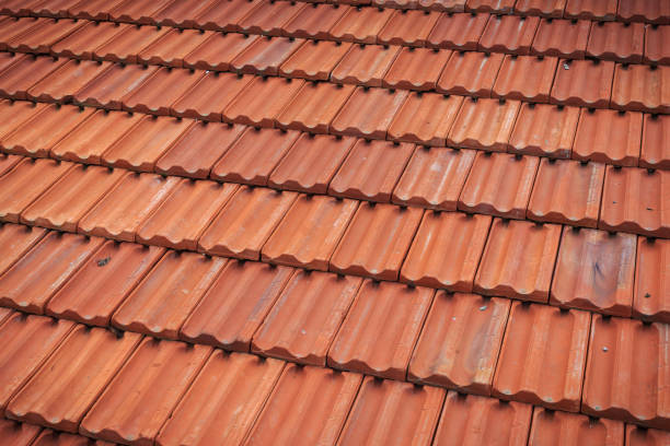 istock Old red tile in-line roof pattern on the house and buildings 1408258006
