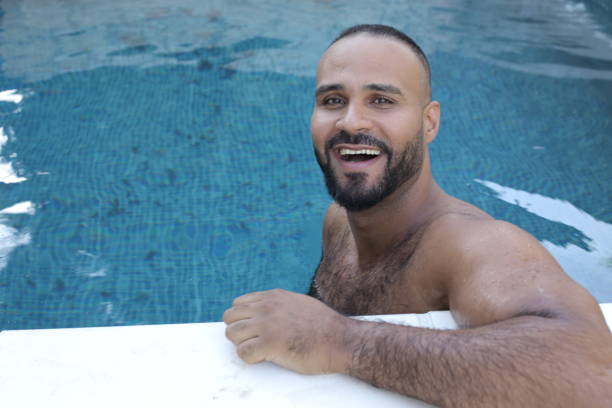 istock Cute man in swimming pool 1408258097