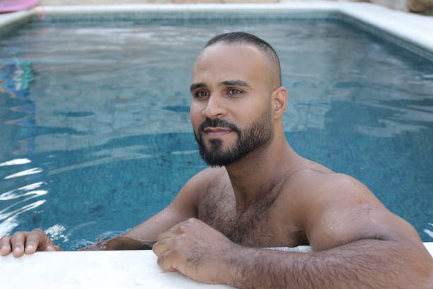 istock Cute man in swimming pool 1408258108