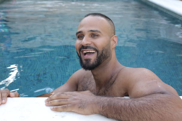 istock Cute man in swimming pool 1408258134