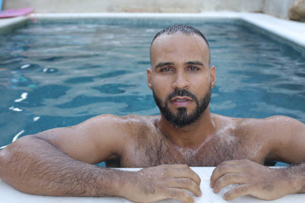 istock Cute man in swimming pool 1408258184