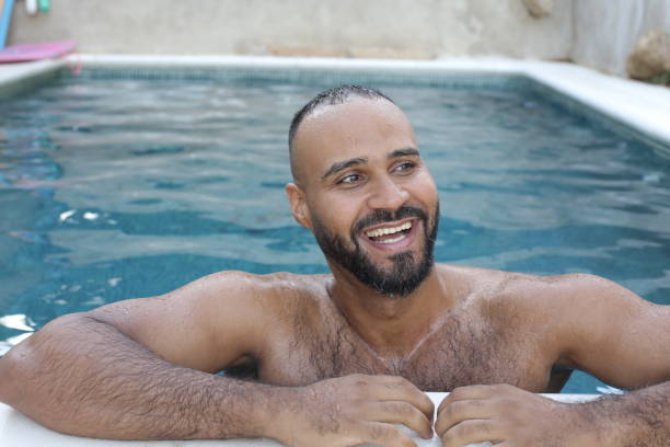 istock Cute man in swimming pool 1408258185