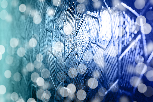 Abstract blurred blue glass ice background.