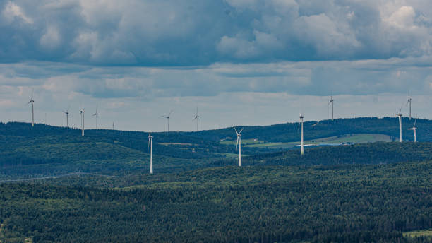 istock Scenic view of wind turbines 1408260876