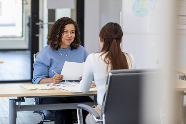 istock Senior manager listens to unrecognizable female employee 1408262053