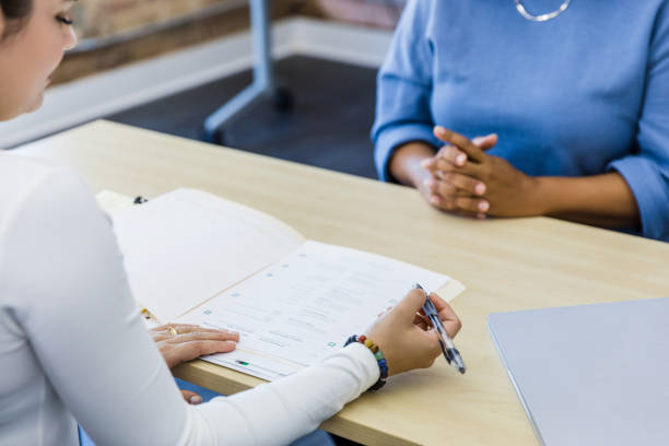 istock Over-the-shoulder view manager reviewing resume during interview 1408262074