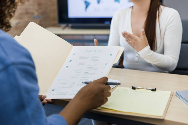 istock Unrecognizable young woman gestures while answering interviewer's questions 1408262087