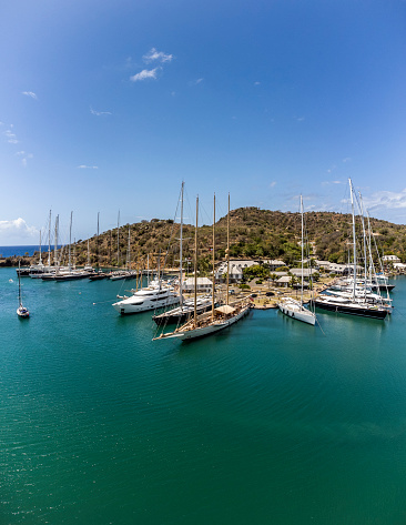 drone perspective of super yachts in the english harbour of antigua